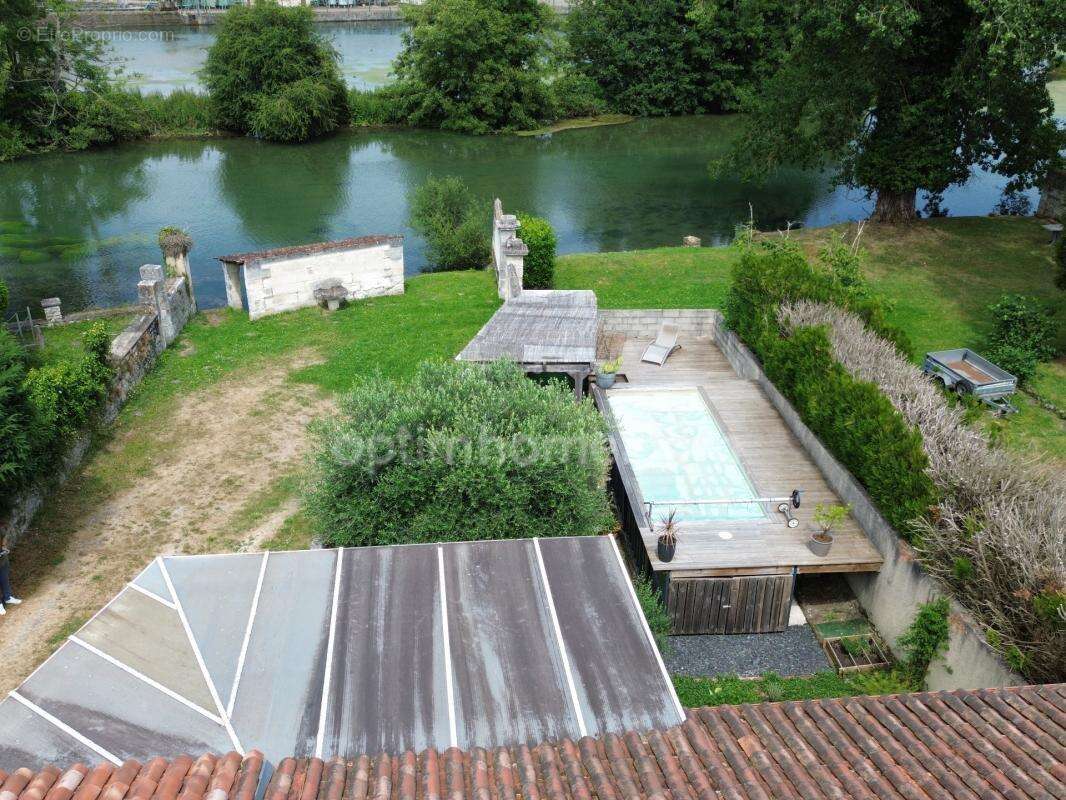 Maison en pierre atypique de 122 m² 3 chambres et 1 bureau – Coup de cœur assuré à MAGNAC SUR TOUVRE (16) - photo 4