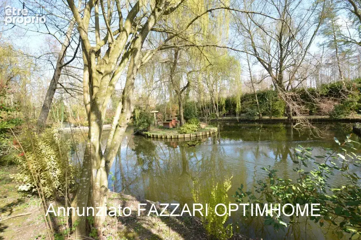 Au cœur d’un domaine clos de 1,5 hectare, ce moulin rénové offre un cadre unique entre étang, rivière et nature préservée - photo 22