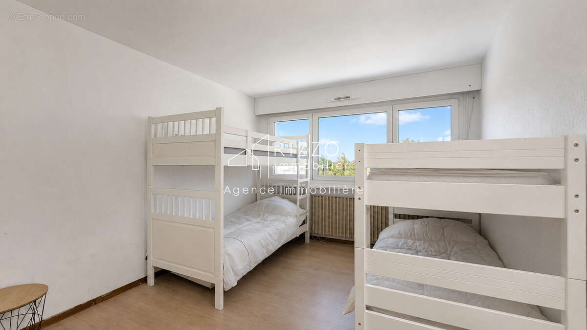 Ferney, T3 en attique 65,5 m2 avec parking et cave - photo 9