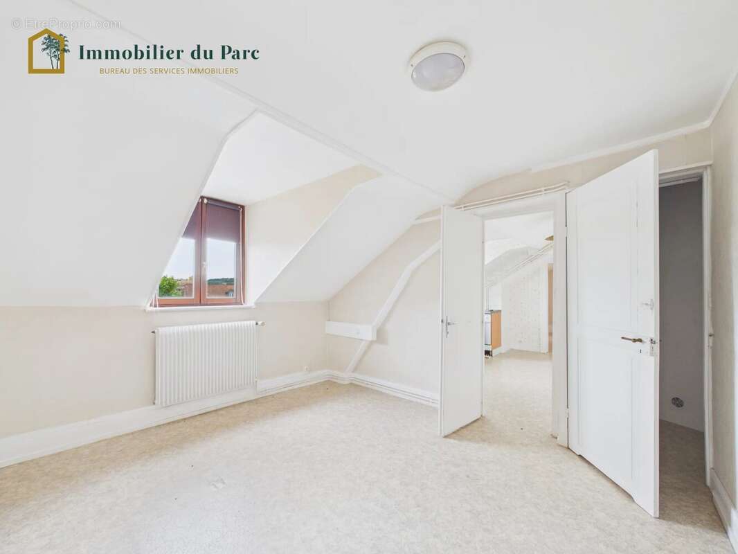 Immeuble de rapport à rénover à Belfort – 198 m², 3 logements + 5 garages – Fort potentiel locatif - photo 13