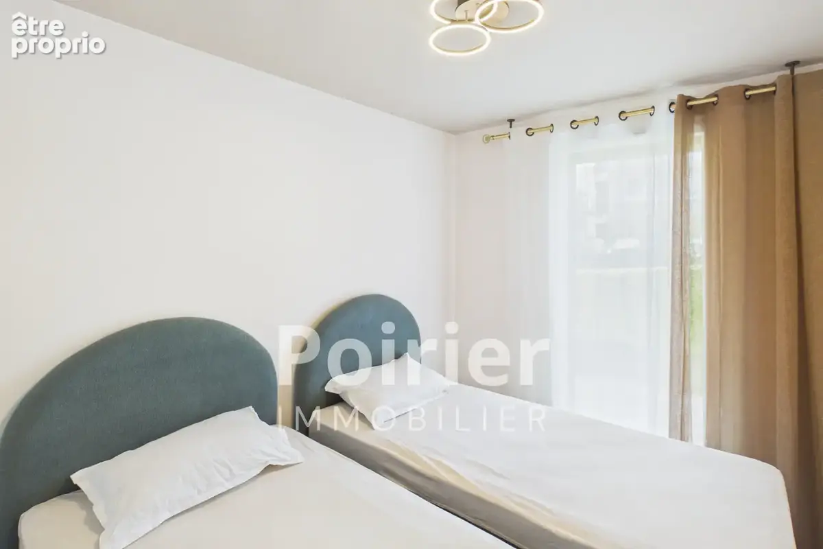 Appartement rénové de type 3 à EVIAN avec jardin vue lac et stationnements - photo 7