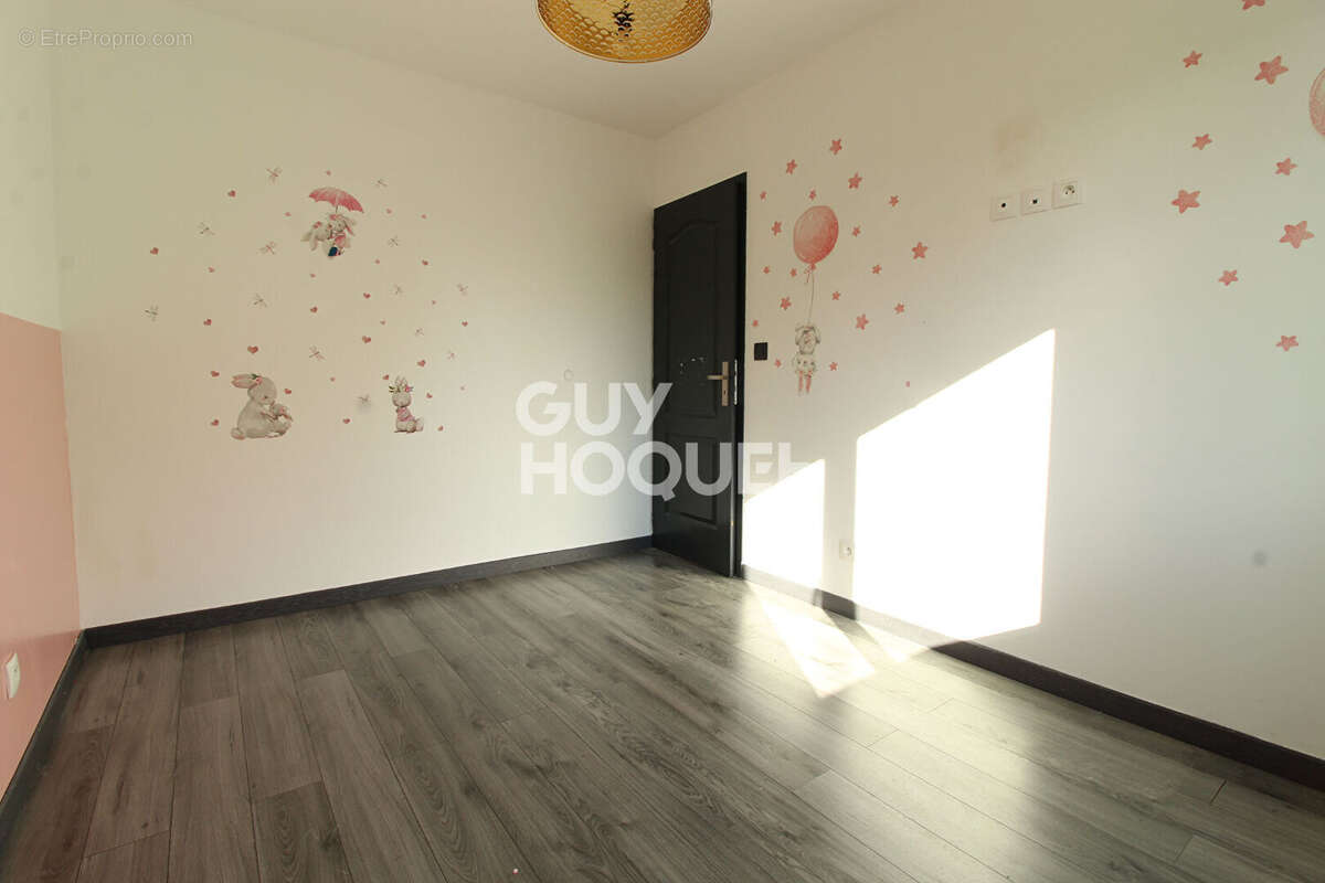 Maison à GUIGNES