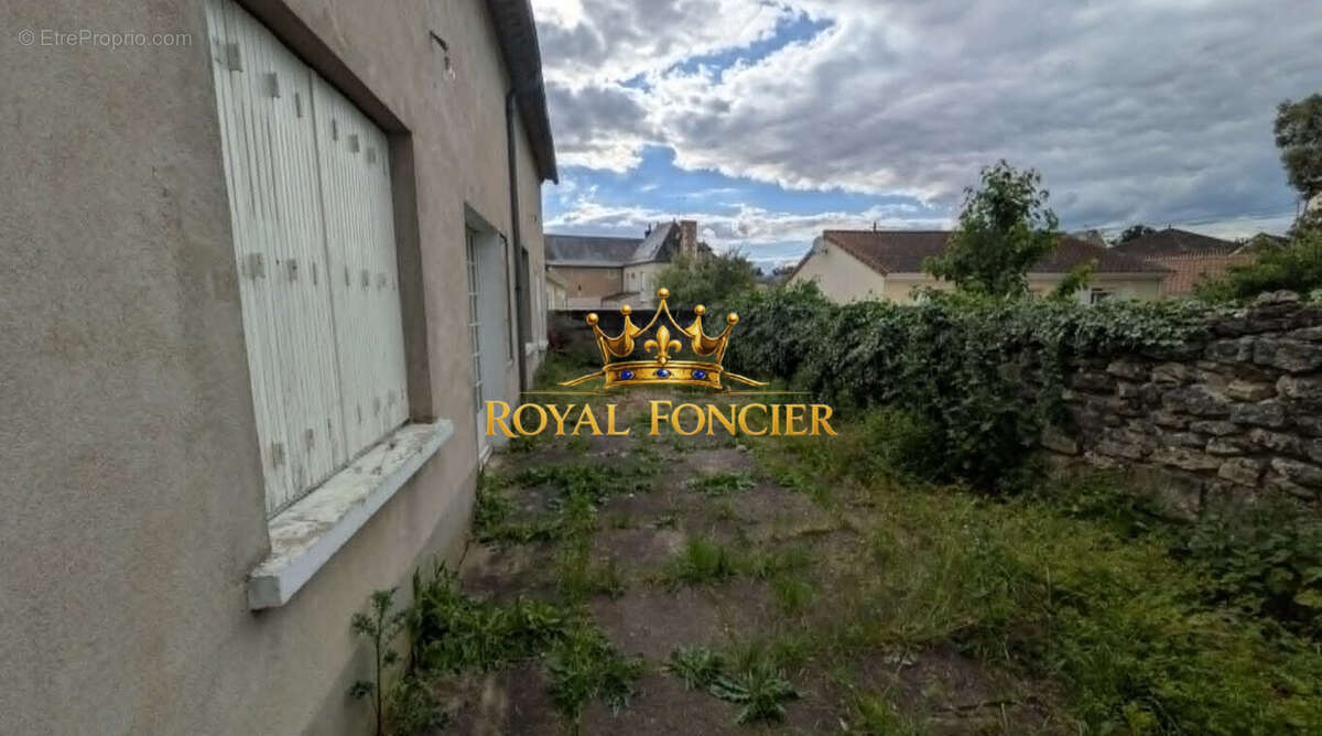 Jardin - Appartement à DANGE-SAINT-ROMAIN