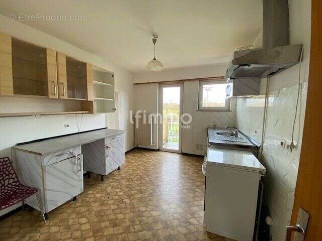 Immeuble comprenant un local commercial et deux appartements - photo 15
