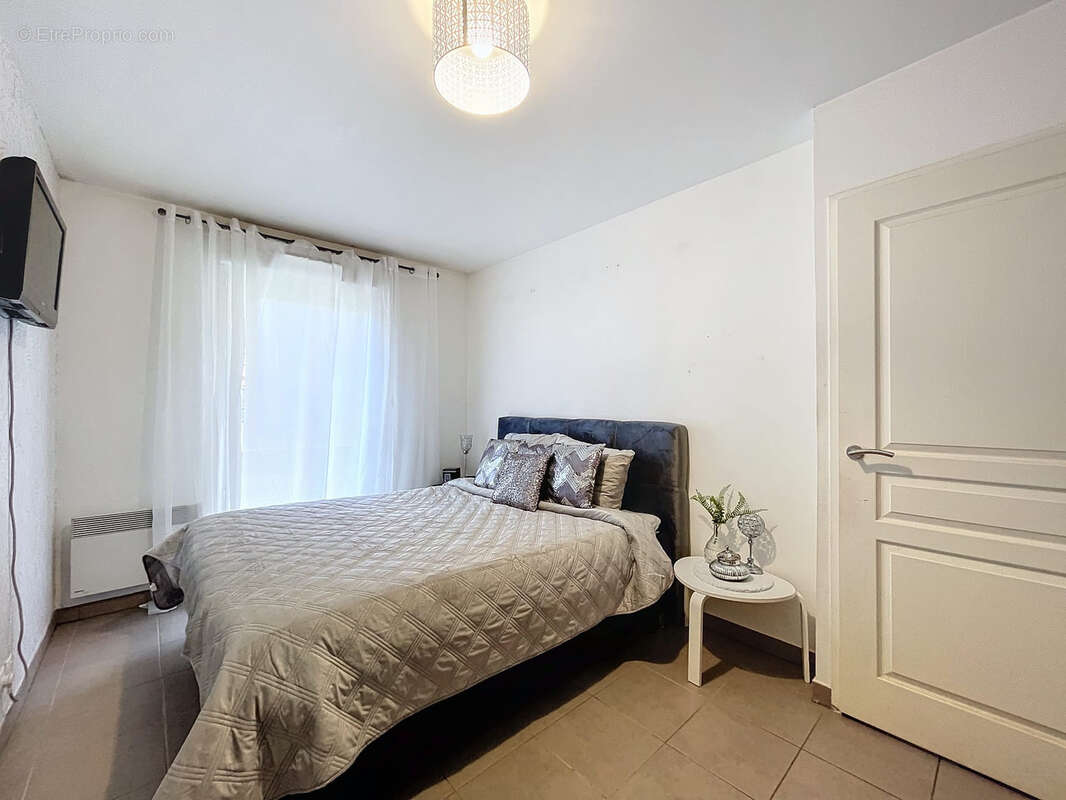 Appartement T3 77m2 dans une résidence sécurisée avec parking privé en sous-sol - photo 7