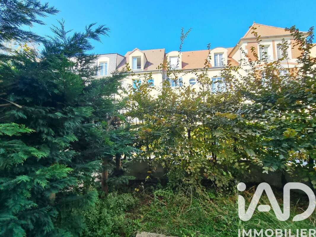 Photo 2 - Appartement à VOISINS-LE-BRETONNEUX