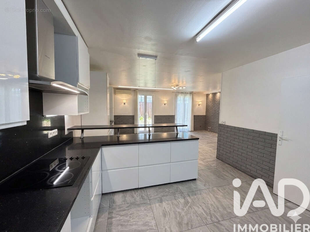 Photo 2 - Maison à AUBERVILLIERS