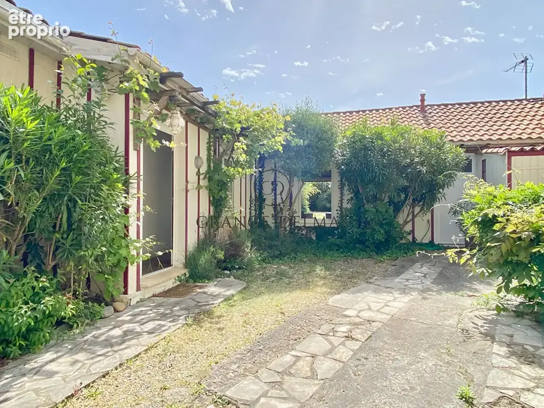 Maison plain-pied sur une grande  parcelle et stationnement - TONDU - photo 5