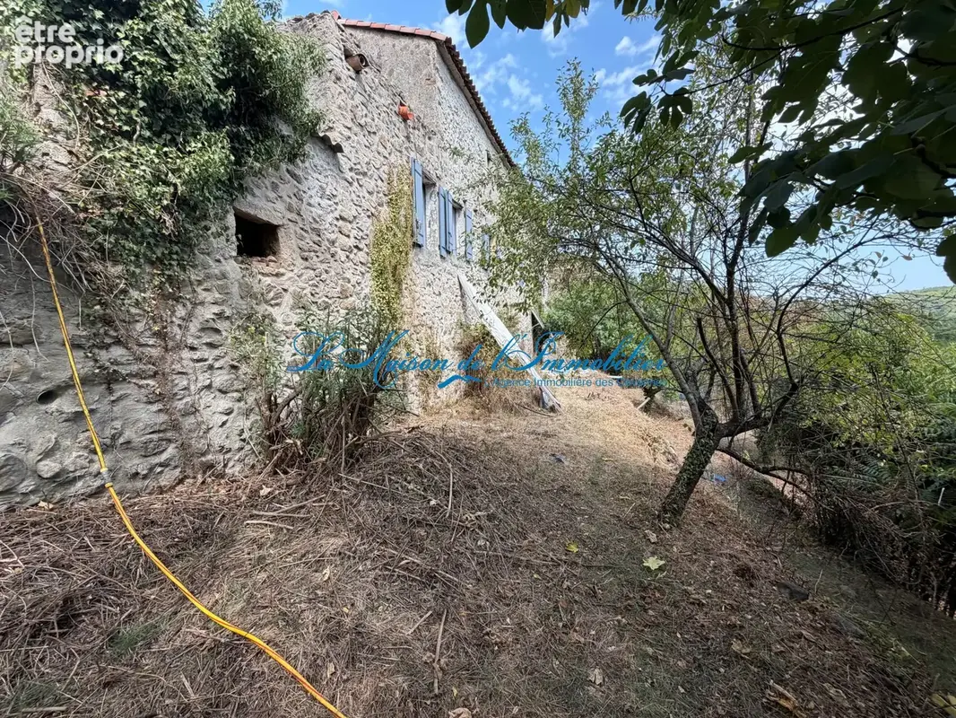 En fond d'impasse, avec vue sur les Cévennes mas en pierres de 350 m2 de surface, 10 pièces et dépendances sur - photo 4