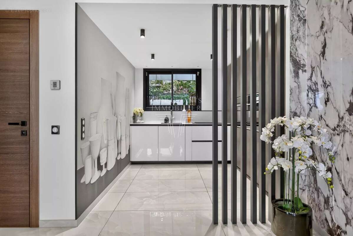 Appartement d'exception en rez-de-jardin. - photo 8