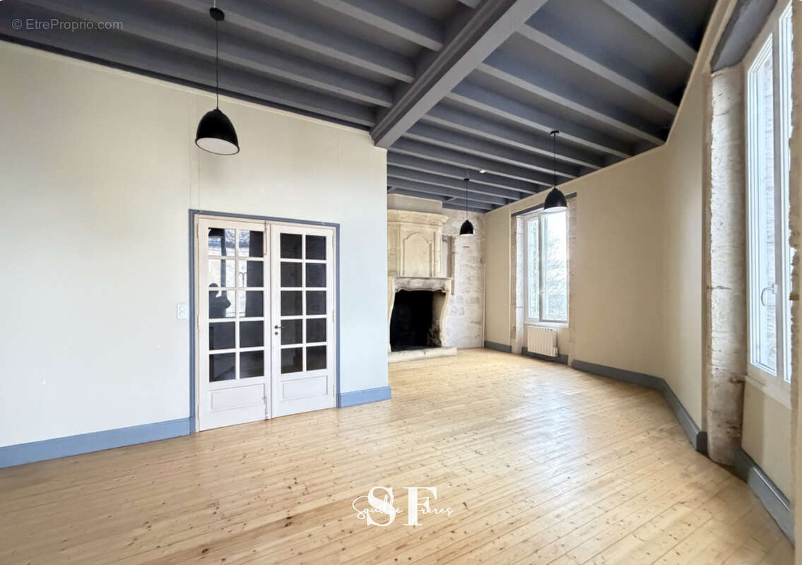 Rive gauche, immeuble de caractere appartement et local commercial - photo 4