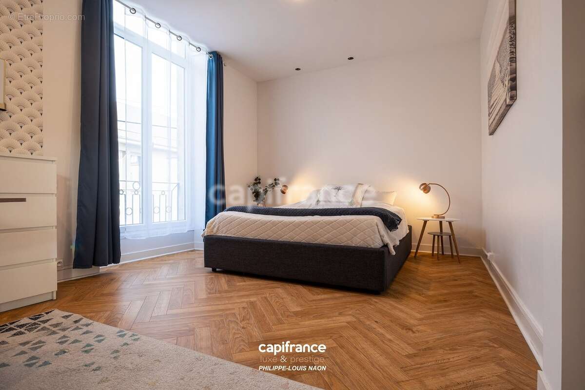 Appartement de style haussmannien d'exception avec grande pièce à vivre de plus de 70m2 - photo 5