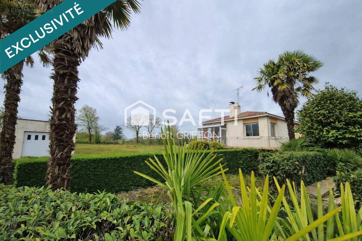 Photo 1 - Maison à LES LANDES-GENUSSON
