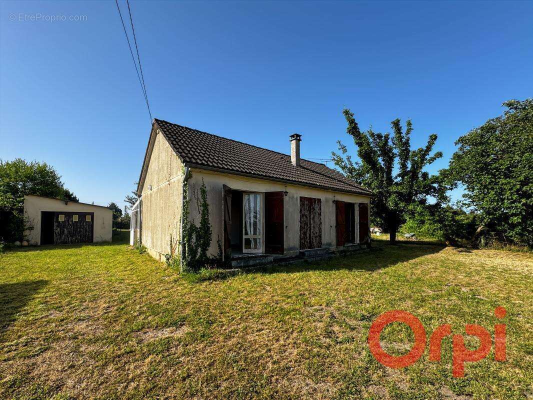 Maison de plain-pied avec garage et terrain arboré à Saulzais-le-Potier - photo 9
