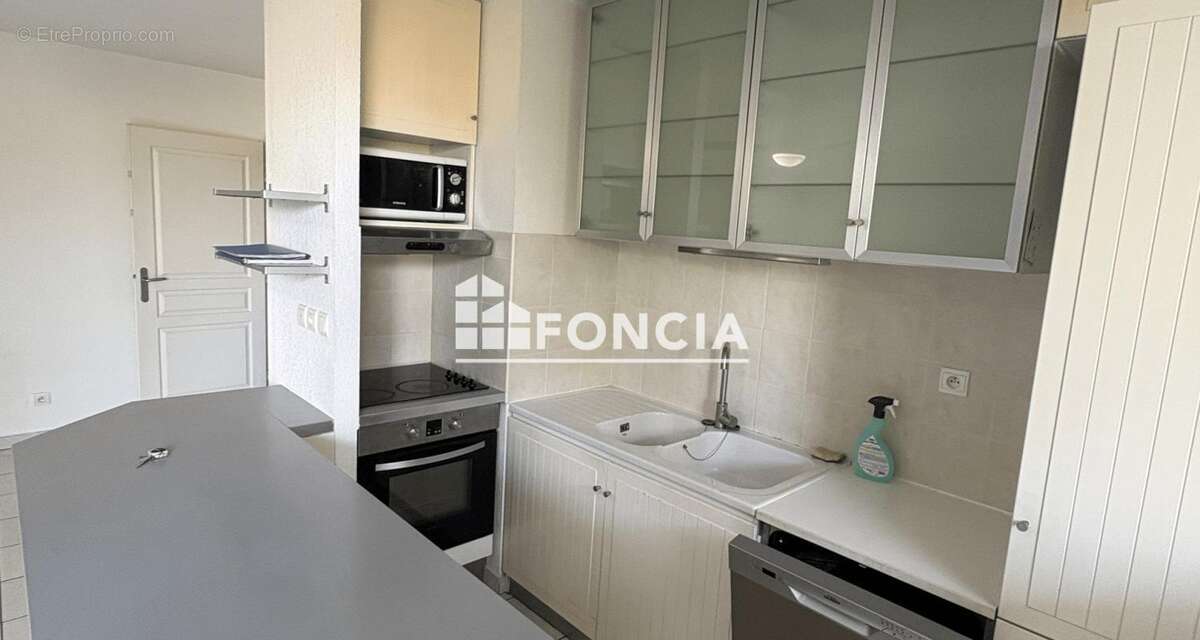 Appartement 2 chambres avec grande terrasse et parking privatif dans une résidence calme et sécurisée - photo 6