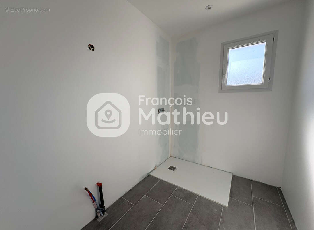 Saint-André-le-Bouchoux - Maison neuve de plain-pied sur 503 m2 de terrain - photo 11