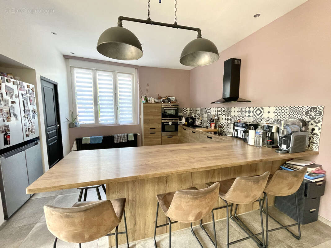 Maison avec beaux volumes - 3 chambres - garage et jardin - photo 6