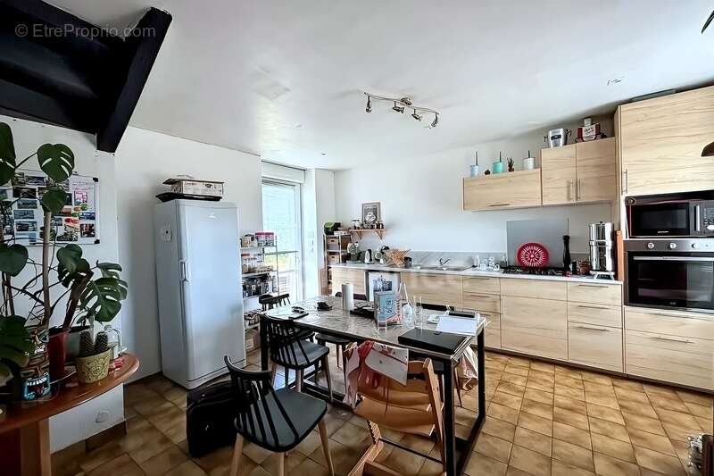 Charmante maison en pierre de 122m², 3 chambres avec jardin, terrasse, cave à GUENGAT(29) - photo 5