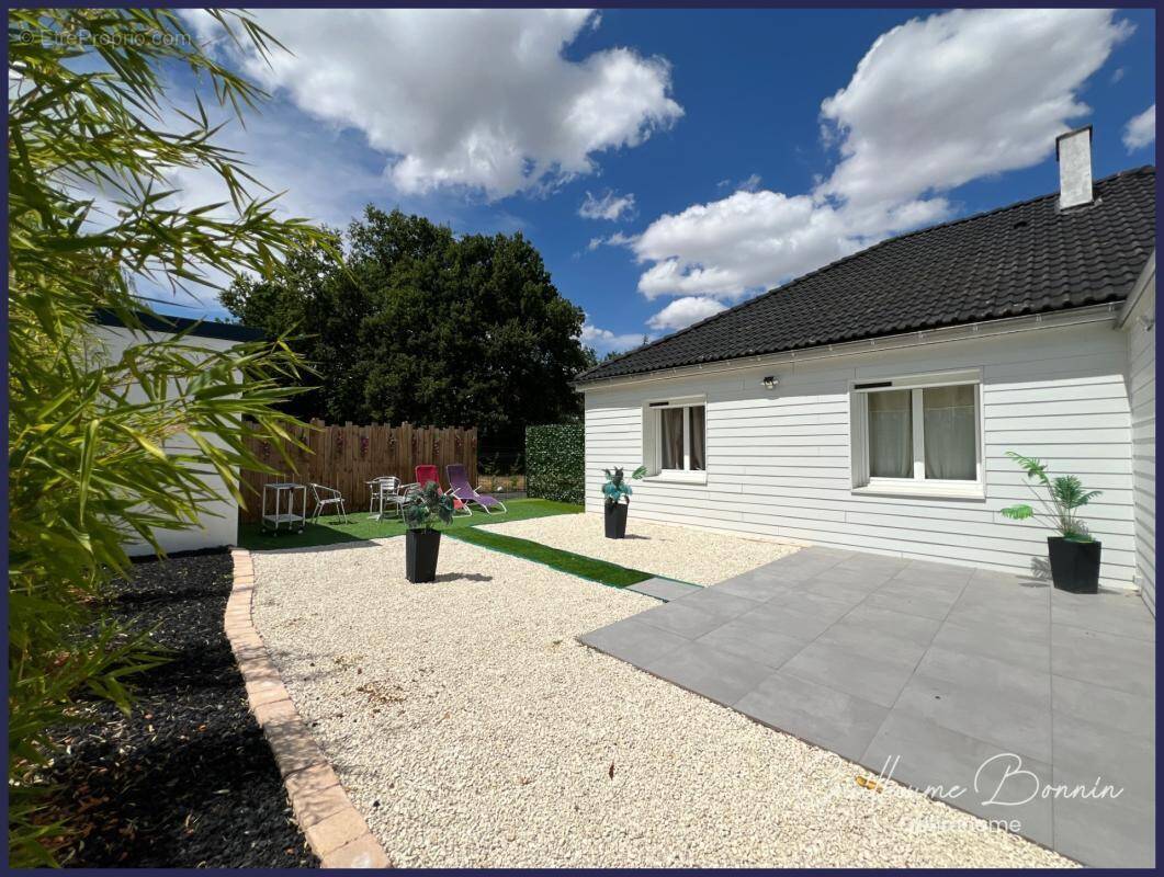 Maison à vendre 5 pièces de 129m², 3 chambres, suite parentale, SPA, garages - DPE C - secteur calme à NOUAILLÉ-MAUPERTUIS 86340 - photo 1