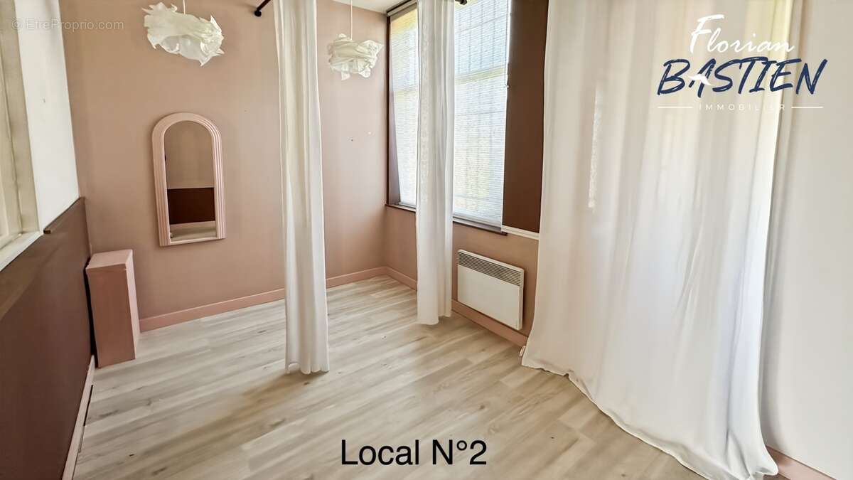 Immeuble en centre-ville – 3 lots – 27 000€/an - photo 18