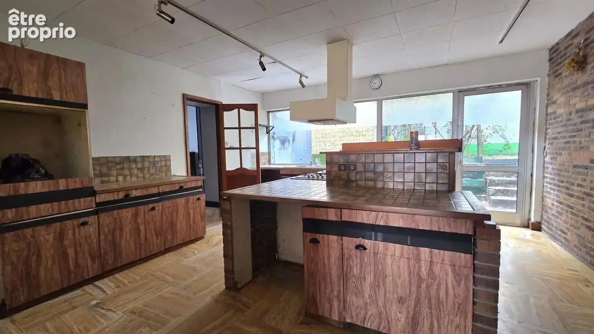 Immeuble comprenant une surface commerciale, une maison et un garage, situé en centre ville de Fourmies - photo 6