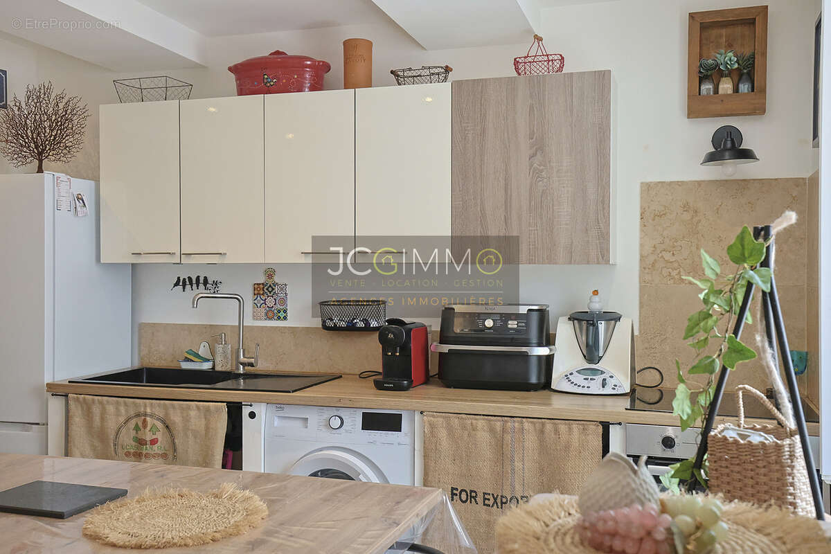 Appartement en rez-de-chaussée 52m2  (T2 + Cave) - photo 4