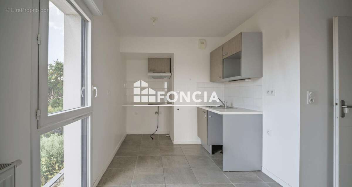 EXCLUSIVITE FONCIA quartier NANTES SUD / BOURDONNIERES : bel appartement T3 récent avec balcon, stationnement couvert, à proximi - photo 6