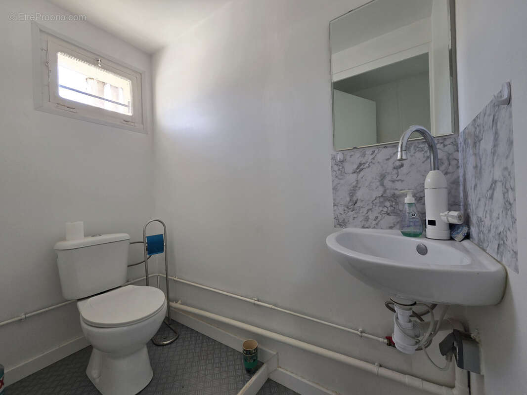 Ensemble immobilier d'habitations et de commerces - photo 18