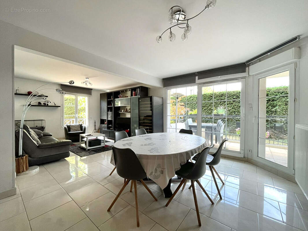Appartement en rez-de-jardin avec garage, parking, cave, terrasse et jardin - photo 3