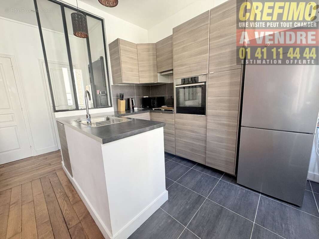 Appartement de caractère avec cachet, belle pièce de vie, cuisine aménagée à Asnières-sur-Seine. - photo 2