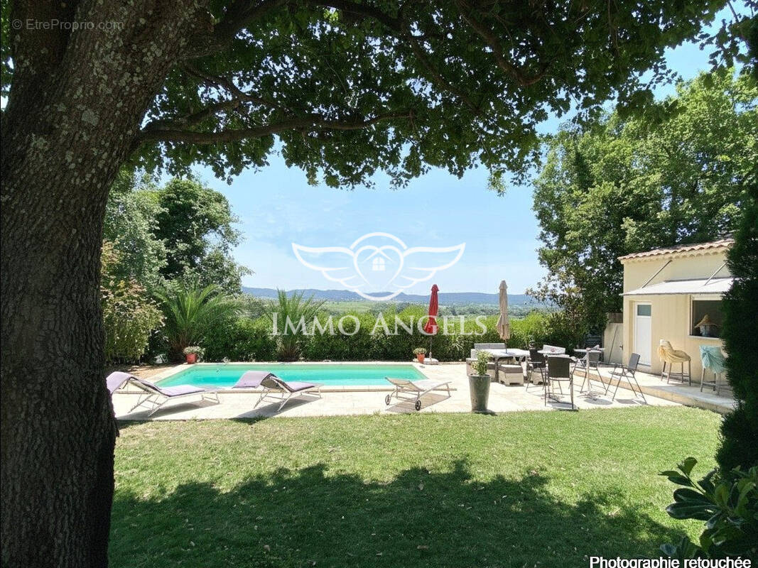 Maison à LAUDUN-L'ARDOISE