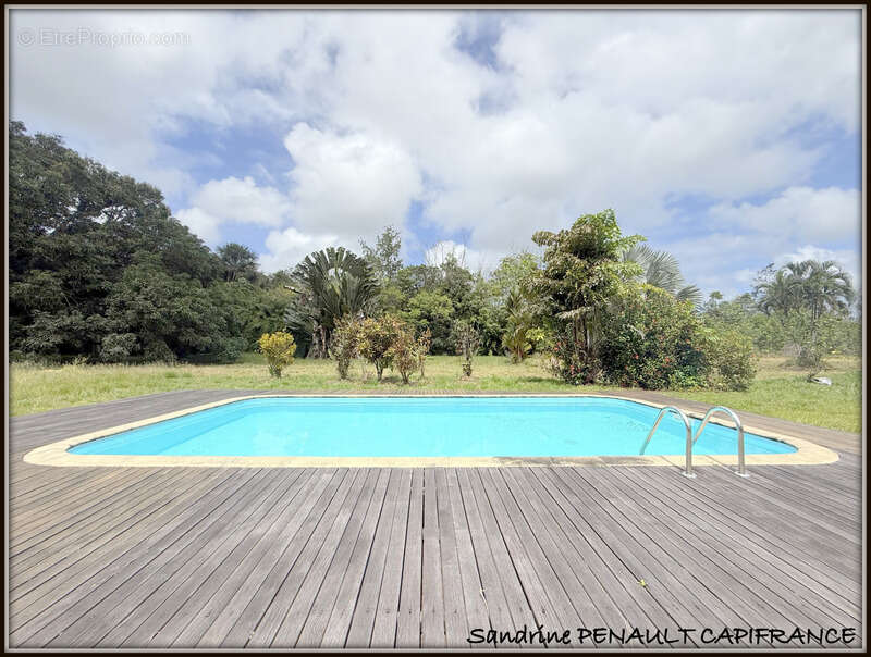 A vendre a sinnamary une magnifique maison t6 de 122 m² superficie terrain 3,5 hectares - au prix de 249 000 € - photo 4
