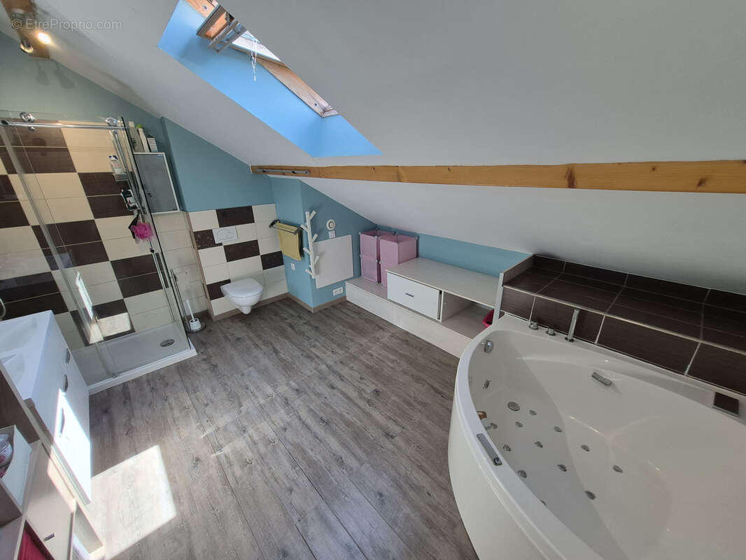Maison individuelle de 2011 de type ossature bois de 141 m2 édifiée sur un terrain de 2292 m2 - photo 12