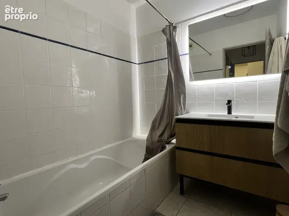 Appartement T3 65.88m² en rez de jardin avec stationnement - photo 8
