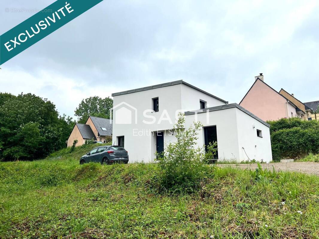 Photo 1 - Maison à PLUGUFFAN