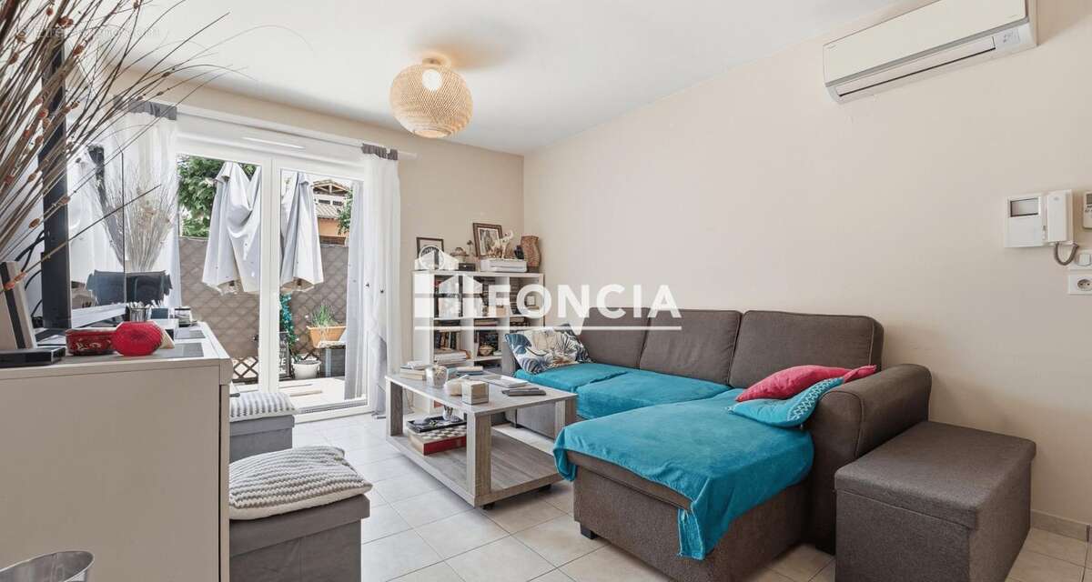 Appartement 2 pièces de 42m2 en rez-de-jardin avec terrasse et parking - loué - photo 3