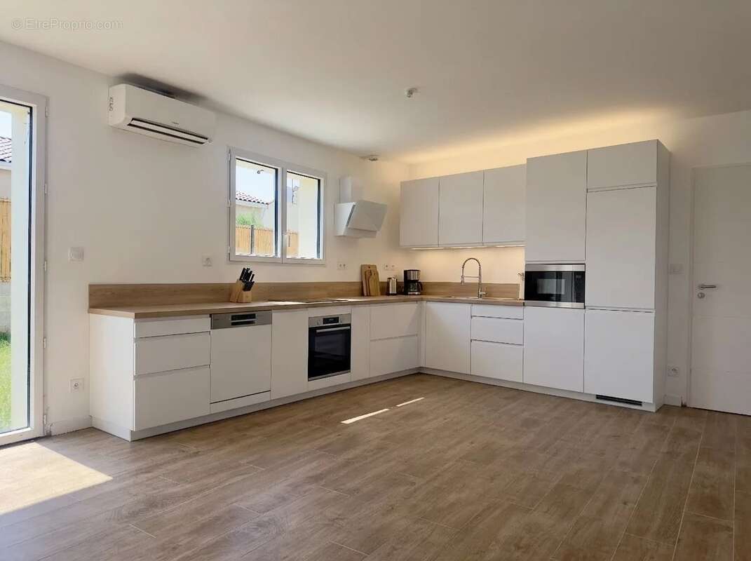 Maison de plain-pied T4 de 98 m² - photo 3