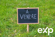 blackboard with text in french 'for sale' on a grass - Terrain à MESANGER