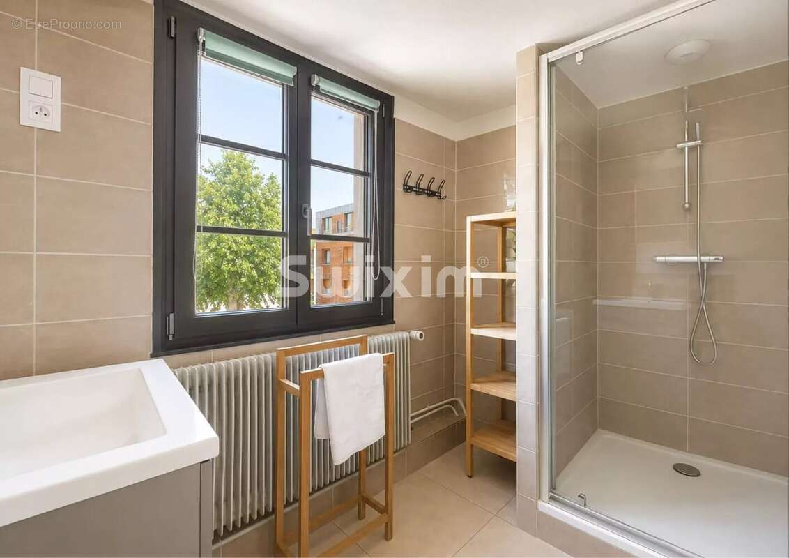 Appartement 4 pièces, trois chambres, combles et stationnement couvert - photo 9
