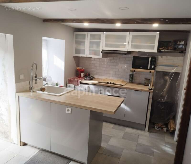 Maison en pierres 3 pièces entre Carhaix et Rostrenen plain pied 92 m2 dont combles aménageables - photo 2