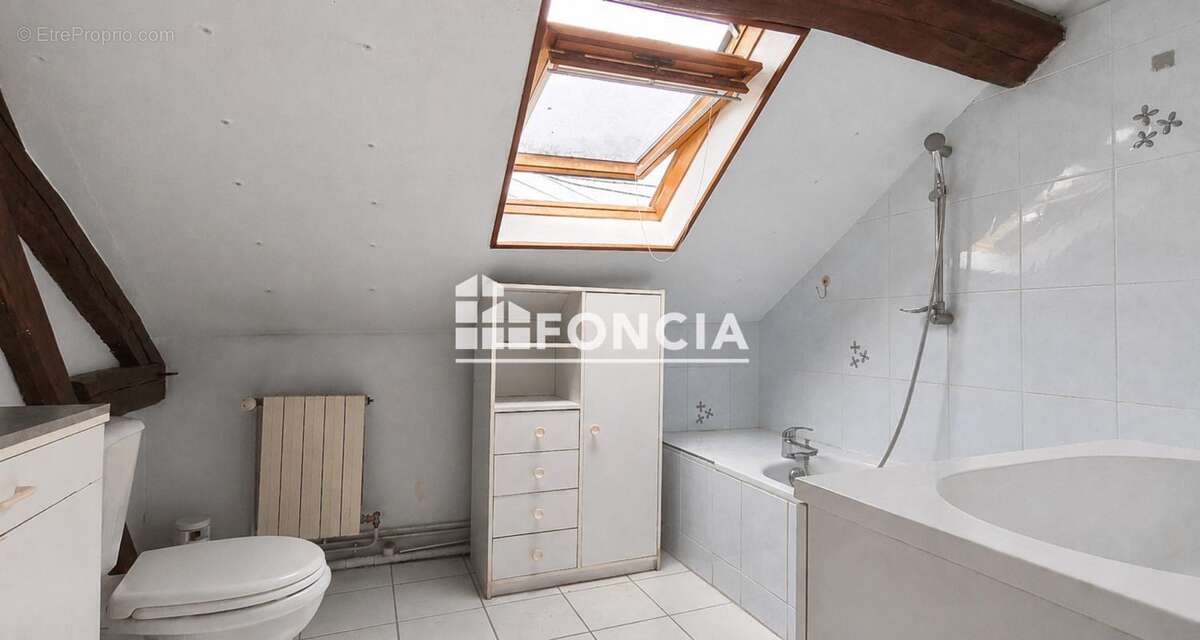 Maison T4 avec terrasse, garage et beau potentiel – Proche du centre-ville de Château-Thierry - photo 8