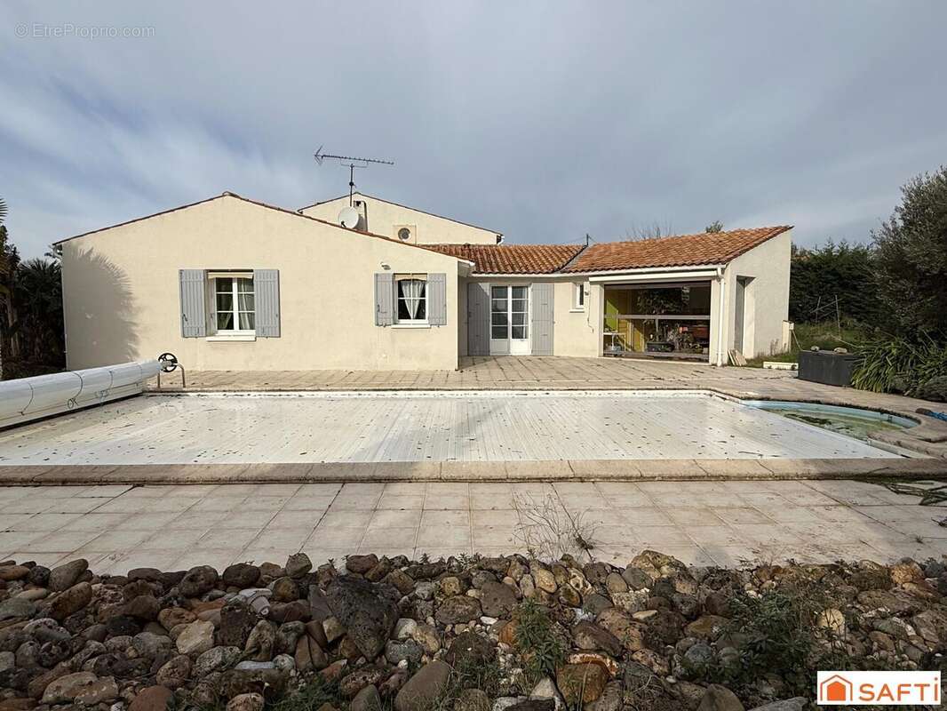 Photo 2 - Maison à LA CHAPELLE-DES-POTS