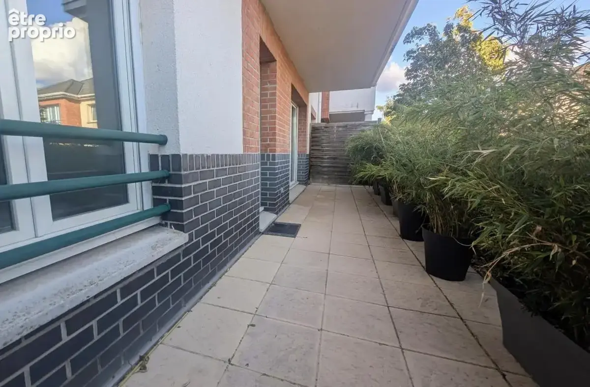 Appartement lumineux en rez-de-jardin avec place de parking - photo 7