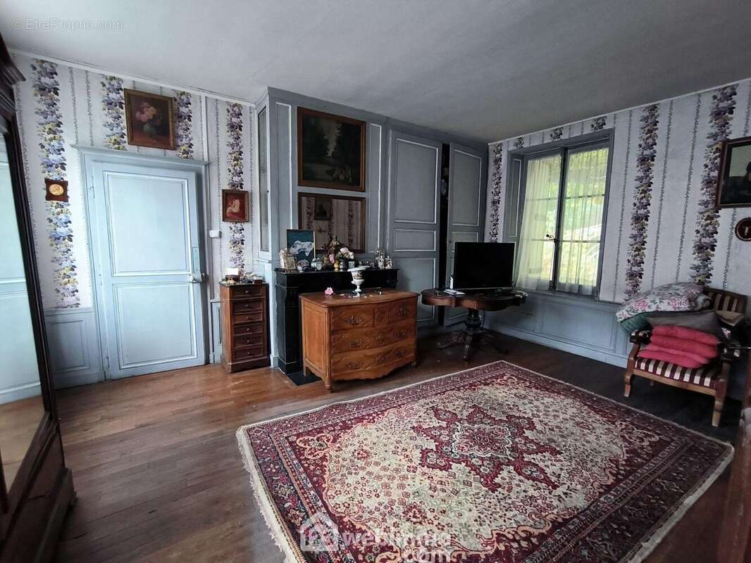 Un deuxième salon de 23 m² avec cheminée - Maison à BRAINE