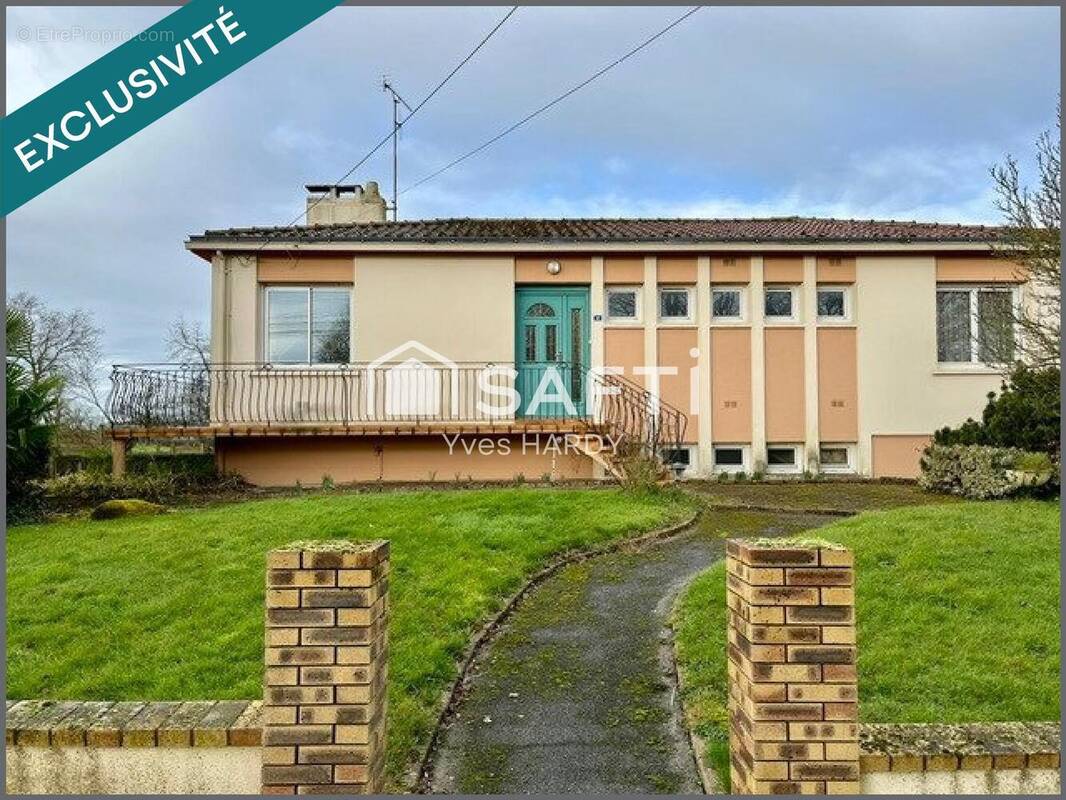 Photo 1 - Maison à LES LANDES-GENUSSON