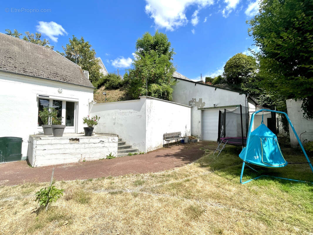 Maison avec beaux volumes - 3 chambres - garage et jardin - photo 4
