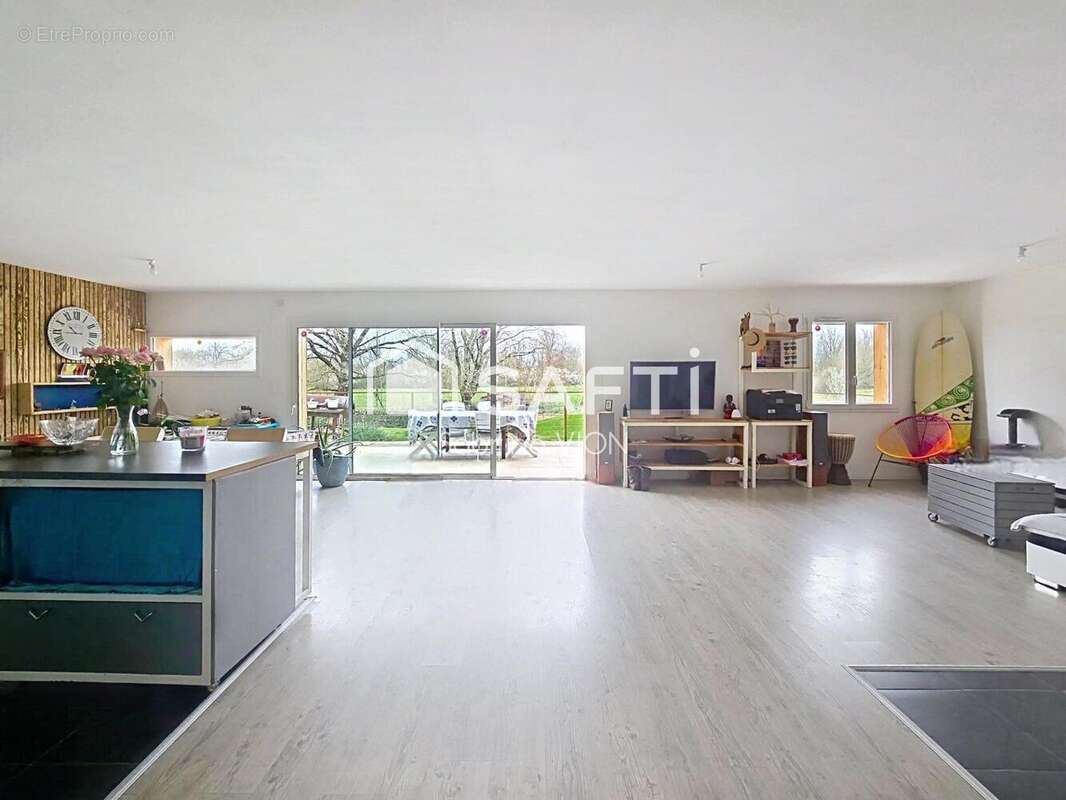 Photo 2 - Maison à SAINT-ETIENNE-DE-TULMONT