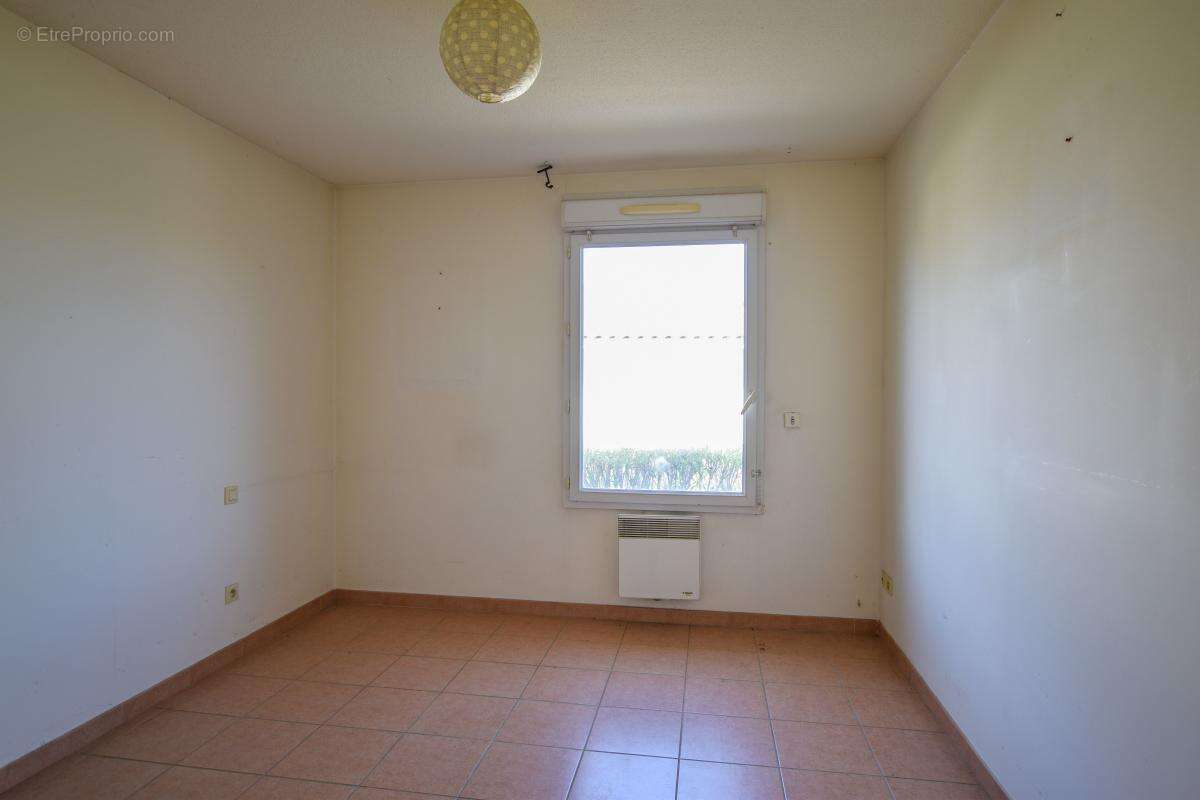 Maison de plain-pied avec garage et place de parking - photo 8