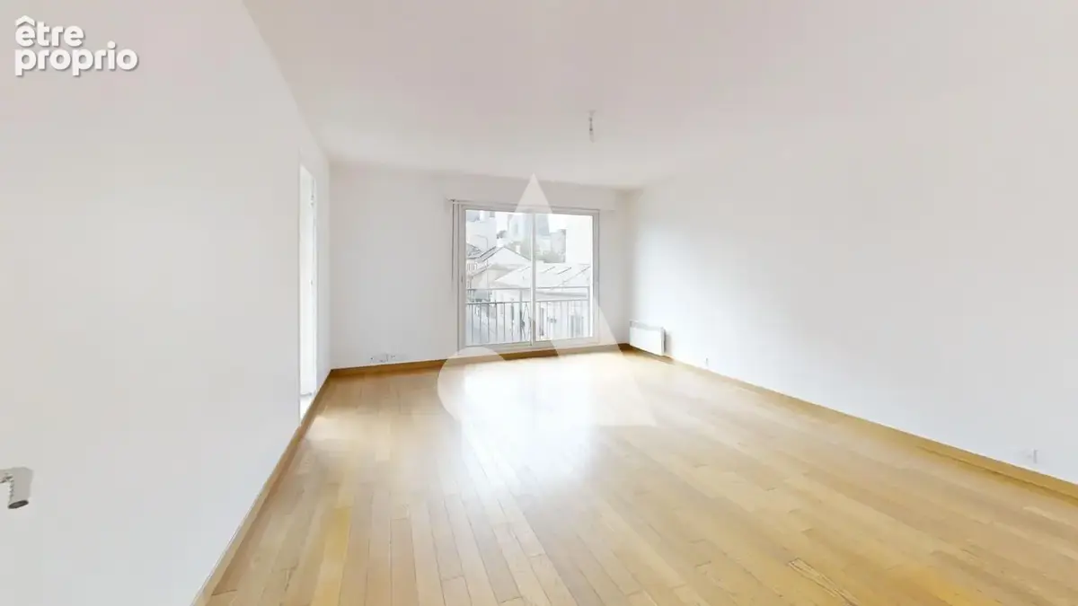 Appartement trois pièces avec balcon et cave Rue des Fauvelles 70 m2 - photo 3