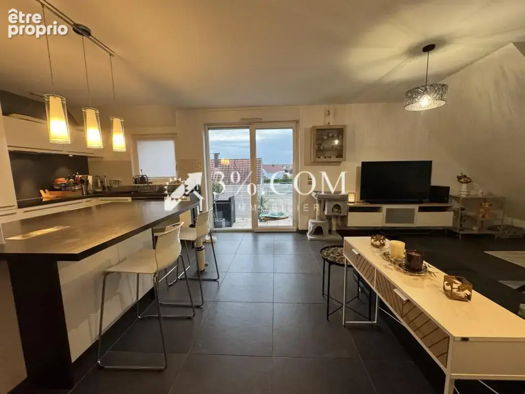 3%COM Très beau F3 avec terrasse- parking- cave - photo 5